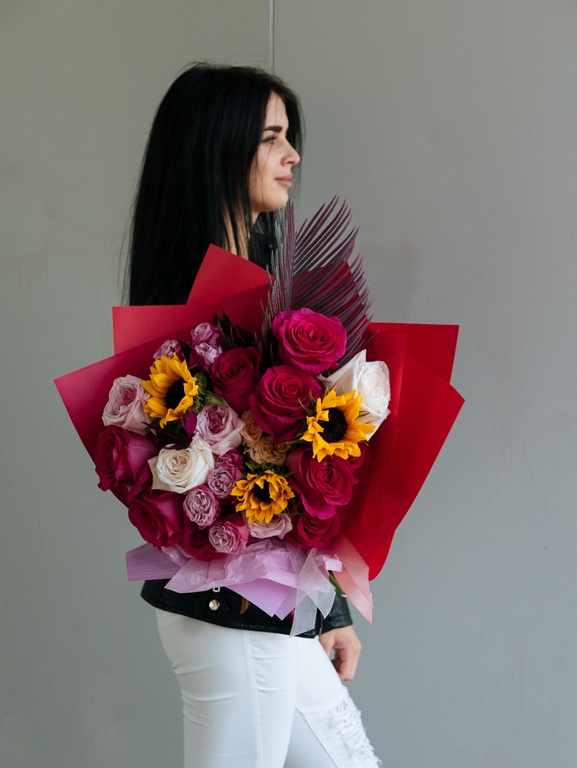 Woman Holding Bouquet of Flowers